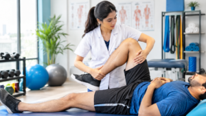 Female physiotherapist providing sports injury treatment during physiotherapy in Andheri